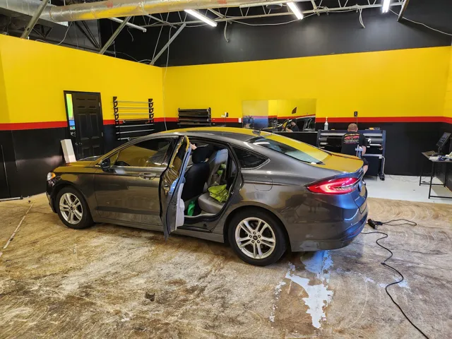 Ford Fusion mid-install in the Colonial Heights tint bay